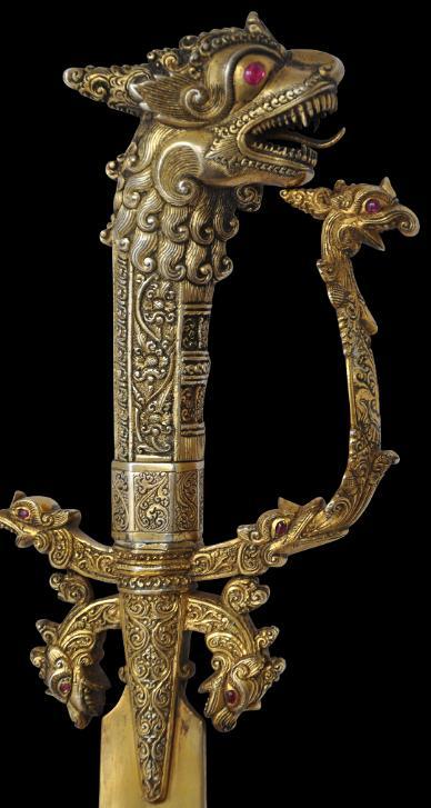 Sri Lankan silver and gold gilt kasthane sword set with red stones, 19th century.from Michael Backma