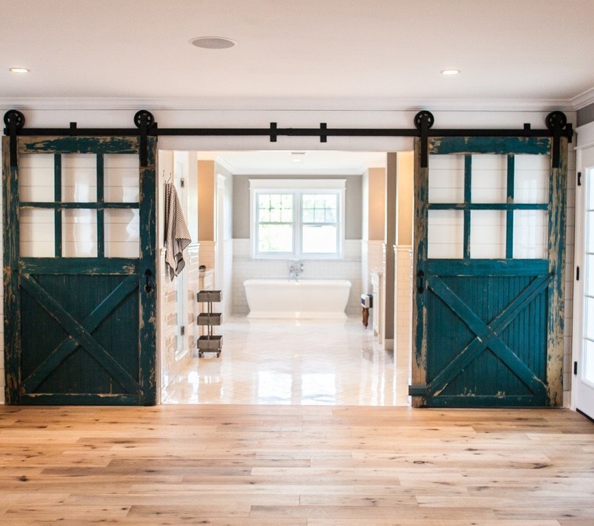 stylish-homes:  100-year-old carriage doors open onto the master bathroom in this