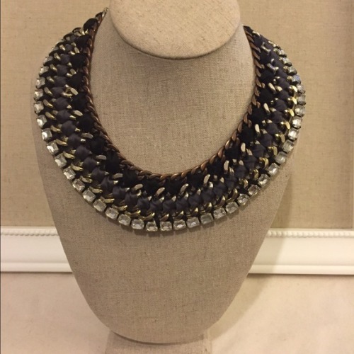 The ultimate statement necklace blends diverse elements of steel chain, brass cupchain, distressed c