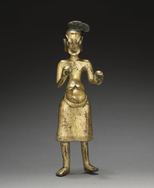Ascetic Holding a Skull, c. 500, Cleveland Museum of Art: Chinese ArtThe figure holding the skull ha