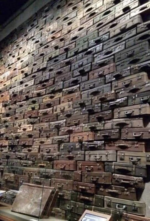 vintageeveryday: A wall of suitcases, symbolizing the deportation of Jews to death camps, forms part