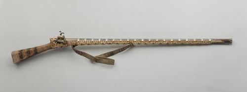 Turkish miquelet musket decorated with red coral, silver, and copper. Late 18th or early 19th centur