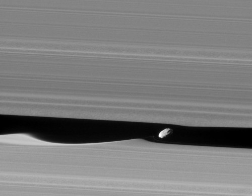 Saturn’s Moon, Daphnis, And Saturn’s Rings.
