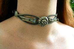 imakinkykittymeow:  steampunkd:  Atomic Number: 47 Pete &amp; Veronica’s This silver steampunk zipper choker is sure to stand out. Hand-made with imported buttons, this choker measures about 16”.  This is beautiful 