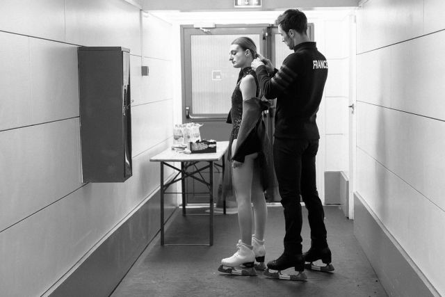 Guillaume fixing Gabriella's hair backstage