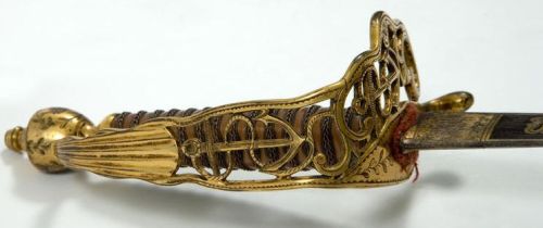 art-of-swords:Naval Presentation SwordDated: 18th century (1780-90 hilt)Culture: German blade of French type, English hiltMedium & Technique: blued etched and giltInscription: ‘SOLINGEN’ and in Latin and FrenchSource: Copyright © 2015 The Fitzwilliam