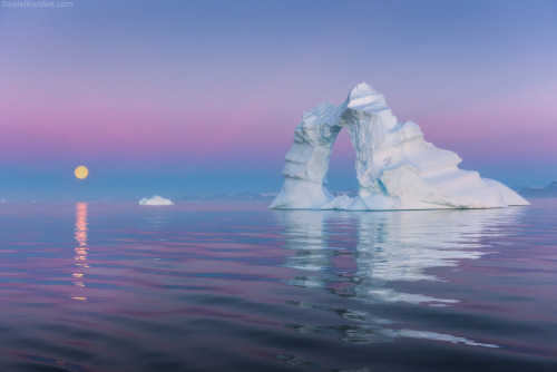 sixpenceee: Moonrise over Scoresby iceburgs. Photography by Daniel Korden.