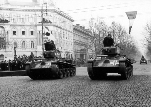 Axis Hungarian 38M Toldi light tanks parade along a Budapest boulevard following their return from t