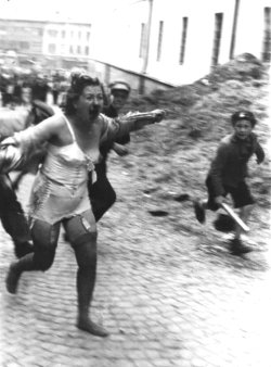 this-is-cthulhu-privilege:  Ukrainian boys with wooden clubs chase a battered and bloodied Jewish woman during the Lviv pogroms. 1941. 