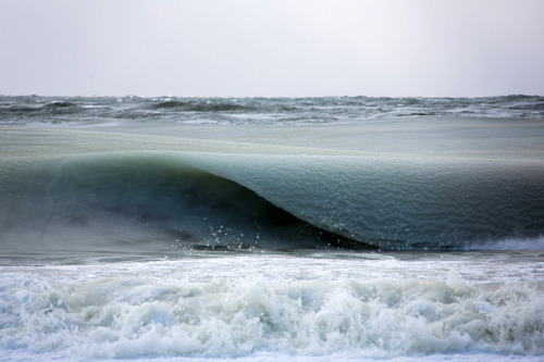 itscolossal:Giant Frozen Waves Infused with Ice Slowly Roll in off the Coast of Nantucket