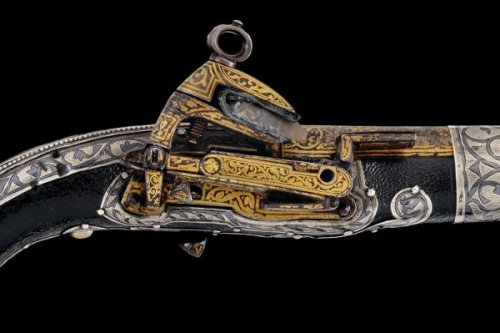 A gold and silver decorated Cossack&rsquo;s miquelet pistol, 19th century.