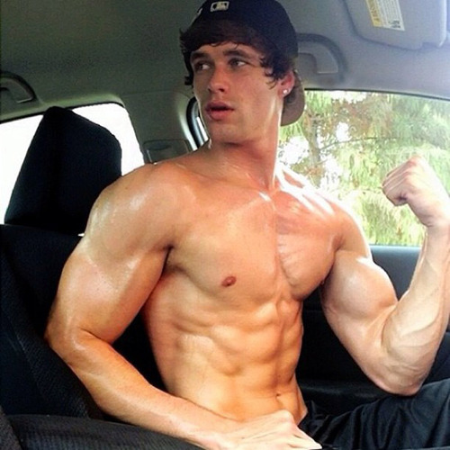 Teen boy flexing muscles