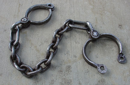 mach-d: Proper convict restraint. No wimpy padlocks here. These are riveted on for the long term (wh