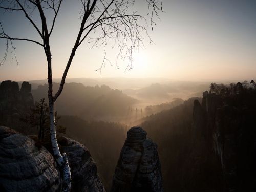 Sunrise from the Bastei. The Bastei is a rock in the sandstone mountains in Saxony, Germany. [x]