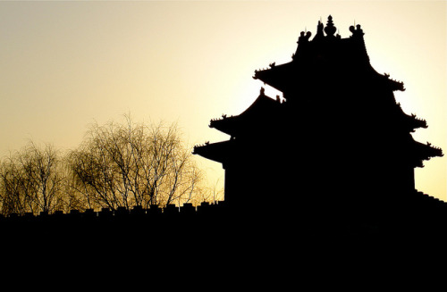 Silhouette of the North-west Guard Tower of the Forbidden City against a Winter Sunsetby itchydogi