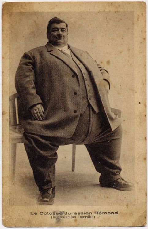 fatmanstories:
thehistoryofheaviness:
Arsène Rémond (1882-1935), dapper French fat man. In 1914, at age 32, he weighed a mere 100 kg (220 lbs) when he joined the French army, but no doubt scarred by his war experience (his regiment was decimated) began gaining weight.  By 1925 and age 42, he weighed 169 kg (373 lbs) at which time a friend asked him to show off his girth for charity.  That started him on a career as a professional fat man where he gained worldwide fame.  By age 45 he weighed 196 kg (432 lbs) and eventually reached a top weight of 315 kg (694 lbs).
Quite the story 