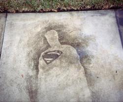 Comics drawn on a sidewalk with a pressure