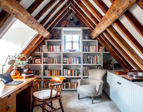 An attic turned into a beautiful home library and study room. Designed by Anna Wilson Interiors http