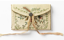 design-is-fine:Pocket book, covered in embroidered