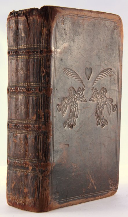 michaelmoonsbookshop:beautiful early 18th century book from c1711 with rare angels and heart embosse