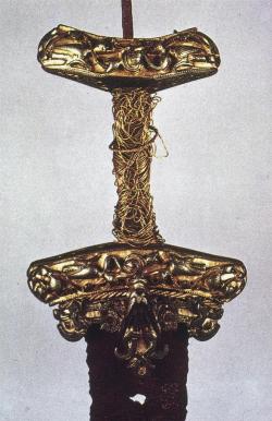 goblinonaswing:Sword hilt, found in Stockholm. 10th-11th c, gold wire, silver, gilt pommel