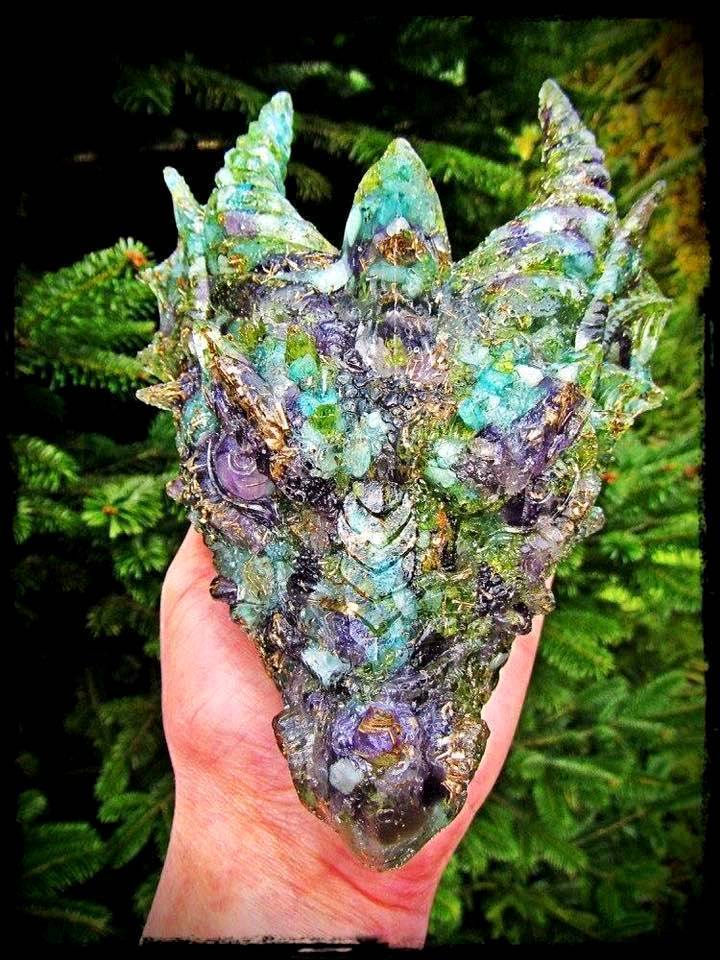 fuckyeahmineralogy:
“Dragon head sculpture created using aquamarine, amethyst, peridot, and rose quartz by Monica van Hamersveld
”