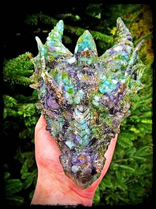 Dragon head sculpture created using aquamarine, amethyst, peridot, and rose quartz by Monica van Ham