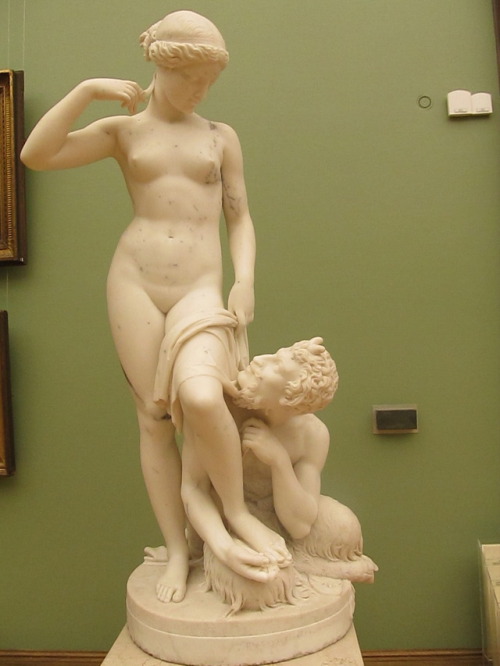 Peter Stavasser, 1850., Marble. “A nymph and a Satyr putting a sandal on her foot.” tret