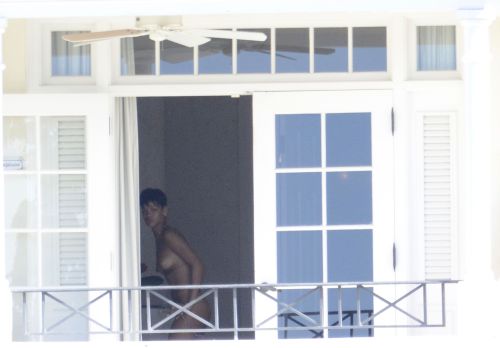Rihanna caught naked while changing bikinis.