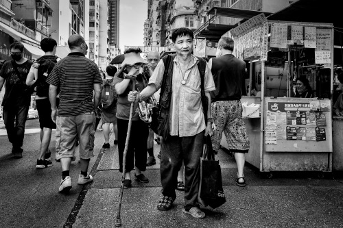 Man with walking stick. Sham Shui Po