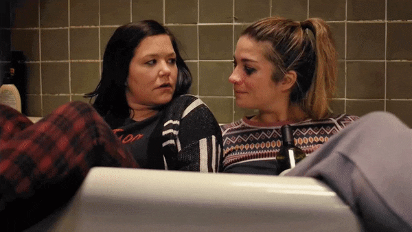 Allison resting her head on Patty's shoulder in the bathtub scene
