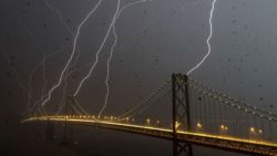 sixpenceee:    Bay Bridge, San Francisco    Here’s an unbelievable picture of eight lightning bolts striking San Francisco at the same time. (Source)   