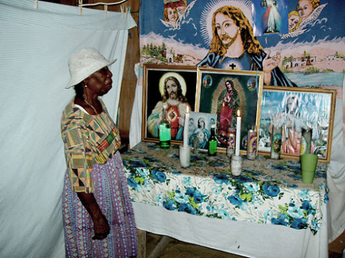 78-year-old Erdangela Polonio, a Garifuna woman of Belize right after prayer.  Photography by Victor