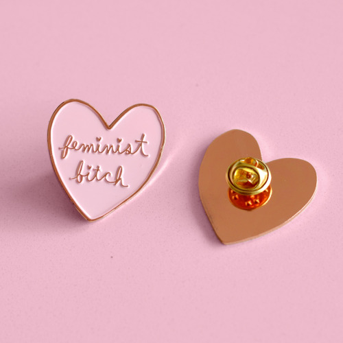 ambivalentlyyours:  When life gives you sexist lemons, you paint that shit pink and rose gold. I’m so excited to introduce my favourite creation yet: the Feminist Bitch soft enamel pink and rose gold lapel pin.  Available here. 