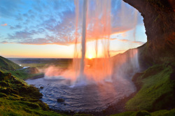 naturalsceneries:  A sunset from behind Seljalandsfoss waterfall, Iceland.  photo by David Shield