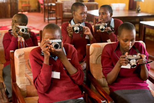 Students try out their cameras for the first time during the inaugural Adolescent Girls Photogr