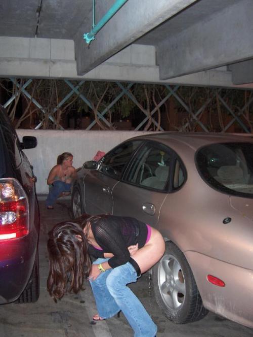 Girl caught peeing parking lot