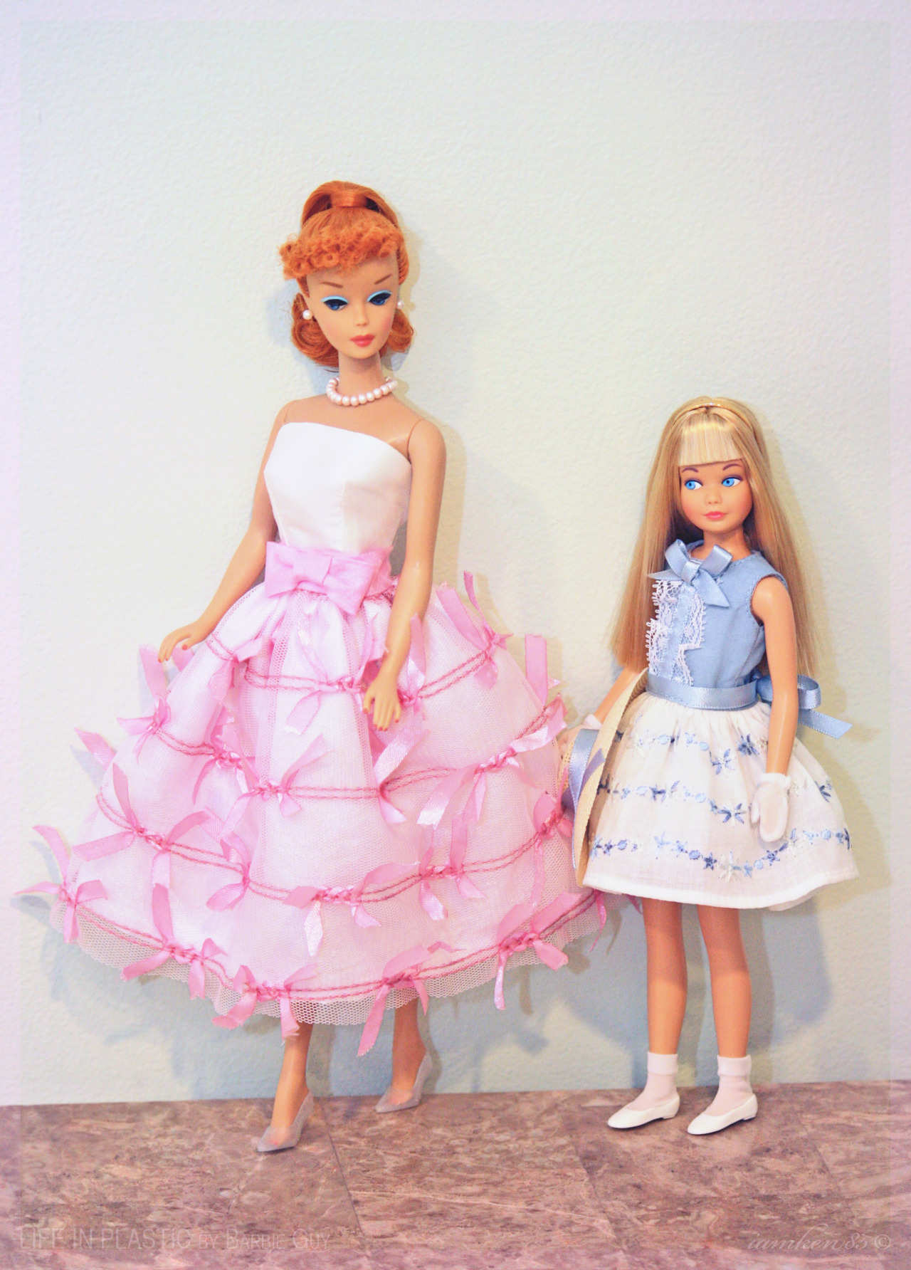 Sisters. In this photo: Let’s Play Barbie™ Doll - Redhead wearing a dress by Pam Seeman (Paintbox Designs), and Skipper® 50th Anniversary Doll