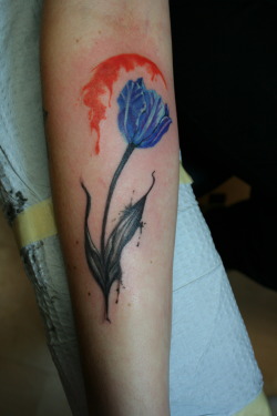fuckyeahtattoos:  Blue Tulip and beginning of an abstract watercolor background on the forearm. Done by Michelle Carter @MisshellCarter at 1001 Troubles Tattoo Studio in Warren, RI. 