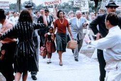 thismynewname:  byrongraffiti:  blackgirlshairrock:    Ruby Bridges was the first African-American child to attend an all-white public elementary school in the American South.    Look how strong her mother was! Black Women have been through it all, and