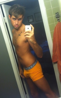 waistbandboy:  Cutie showing off his new orange American Eagles!