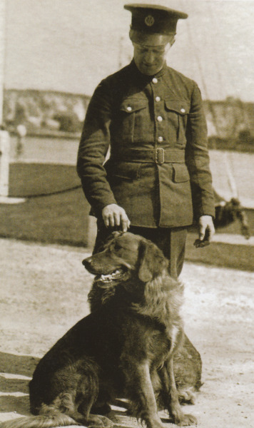 T.E. Lawrence with the Smith family dogs.