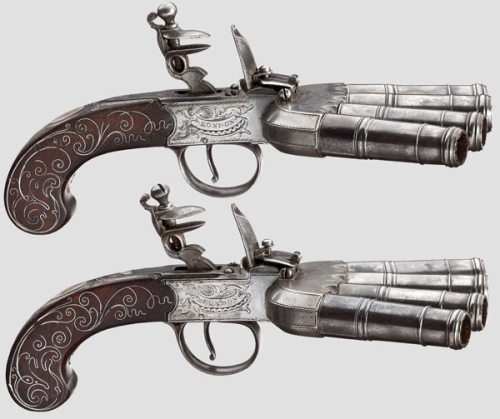 A matching pair of English duckfoot flintlock pistols, circa 1800.from Hermann Historica