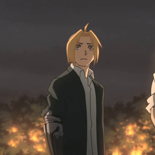 A cropped screenshot of Edward from fullmetal alchemist brotherhood. He stands center and has a torn right sleeve. he looks concerned above the viewer. from the episode where he fights pride in woods.