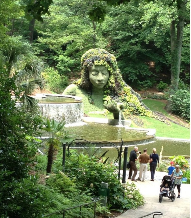 waterfall and statue botanic garden