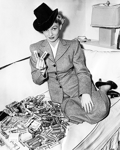  Veronica Lake with some of the hundreds of packages of gum, which employes of the