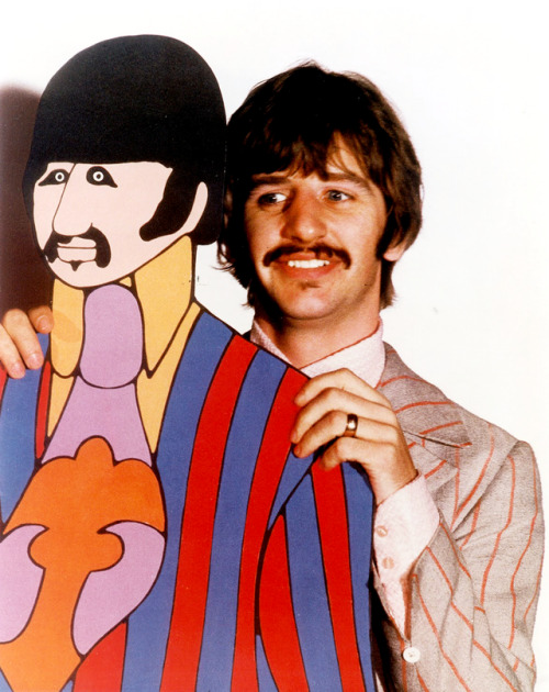 psychedelic-sixties:The Beatles posing with their cardboard Yellow Submarine (1968)