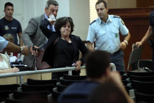 fromgreecetoanarchy:  The mother of murdered by neonazis Pavlos Fyssas (antifascist hip hop artist from Greece) throws a bottle of water against the murderer of her son during the trial of the neonazi party Golden Dawn in Athens (6 October 2015).