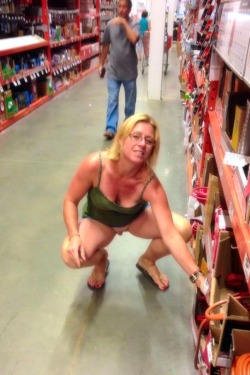 flashinginstores:  Another naughty wife that goes shopping without any panties. Of course Home Depot is #2 of the places to go and show off your nasty snatch if you are a sexy, slutty wife like her. Would love to walk up on her and finger her pussy in