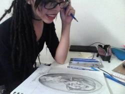 hieraticscale:  Actually an old picture, i miss my lip ringss! I never finished that drawing and now have no clue where that sketchbook even is.  I like this picture because it looks like i’m about to stab the paper.. and for some reason thats funny